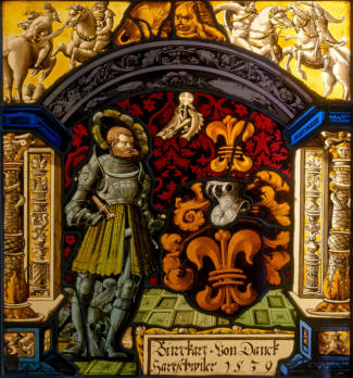 Vitrail aux armes des Burckart von Danckhartwilet, et dans les angels supérieurs, des combats de cavaliers